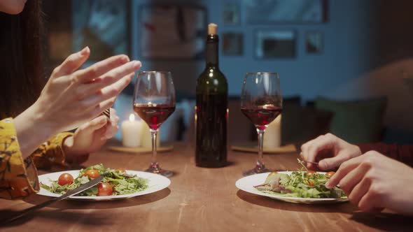 Young Couple in Love Dinner Talking and Drinking Red Wine Cozy Saint Valentines Day Celebration at