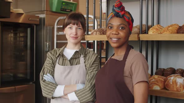 Portrait of Two Multiethnic Women at Work in Bakery