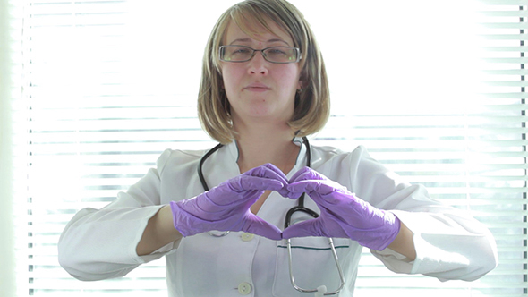 Women Doctor Showing Fingers Heart