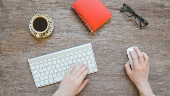 Businessman Working At Computer In Office alt