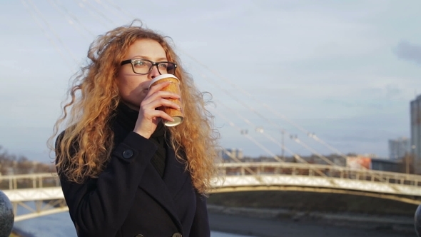 Girl On a Walk With a Hot Drink