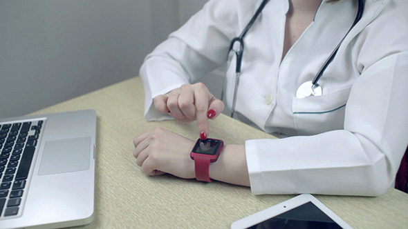 Doctor Using Smartwatch Wearable Technology