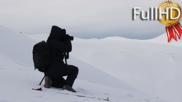 Woman Taking Landscape Shot in Winter Mountains.