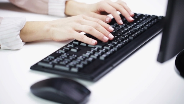 Woman Hands Typing On Computer Keyboard At Office