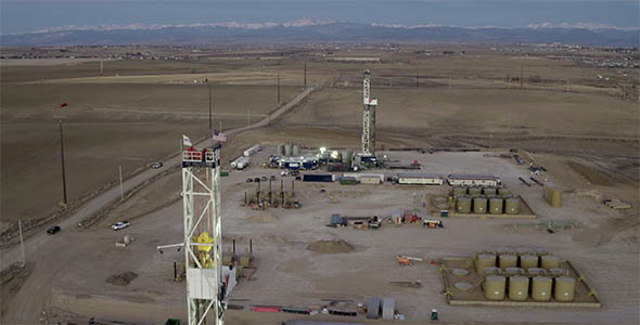 Aerial View of Oil and Gas Drilling Platforms at Sunrise