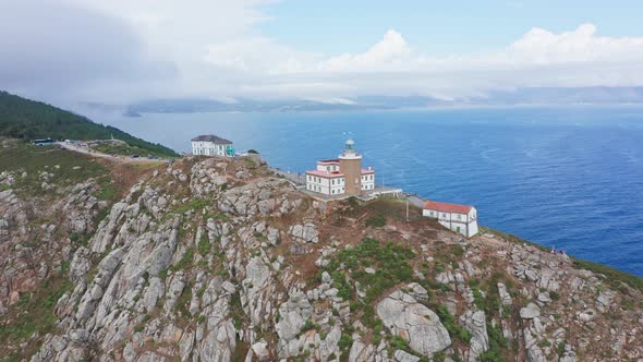 180 degree aerial view of famous lighthouse on rocky cape with the immensity of the sea in front of