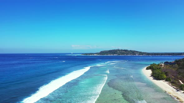 waves washing the shore. aerial Seascape With Coral Reef And Atoll In The Blue Sea Bali, Gilli islan