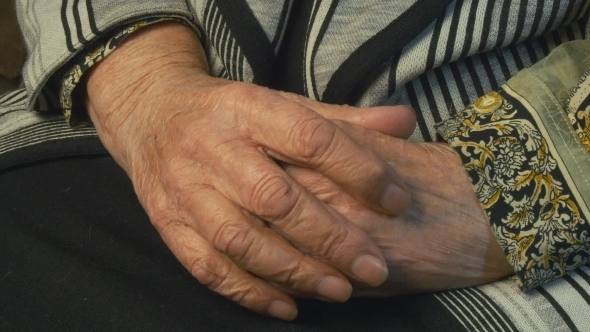 Senior Woman Massages Painful Hands
