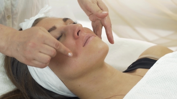 Cosmetologist Wipe Above Lips Of Girl By Napkin alt