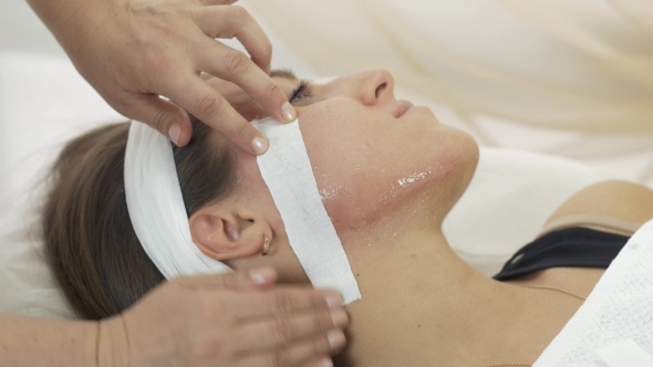 Cosmetologist Hands Make Epilation Of Girl Chin In Beauty Saloon. 