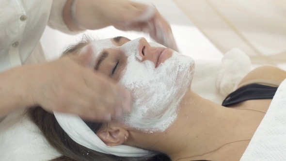  Cosmetologist Hands Rub In Clay Mask Into Girl Face In Beauty Saloon