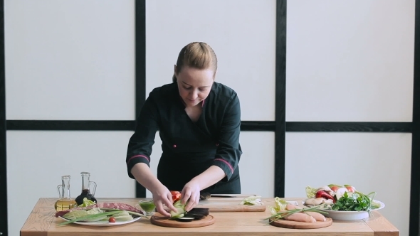 Cook Lays Out Vegetables On The Board For Grilling