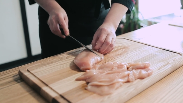 Cook Hands Thinly Slicing Chicken alt