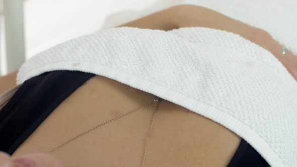 Girl Lie Under White Blanket In Beauty Saloon On Cosmetic Procedures alt