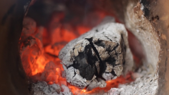 Fireplace With The Smoldering Piece Of Wood