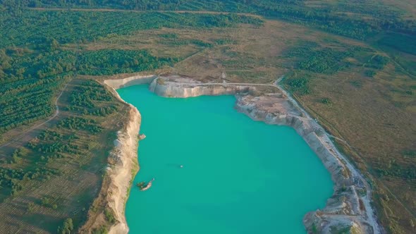 An artificial lake in chalk quarry. view from drone. Turquoise water background