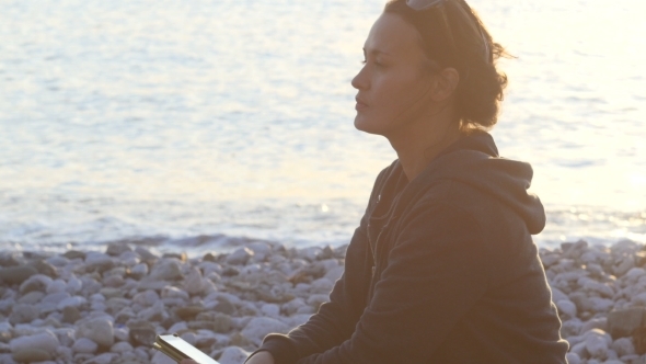 Attractive Woman Is Using Smartphone At Sunset 