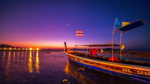 Dawn In The Sea Against The Backdrop Of a Fishing Boat In Phuket