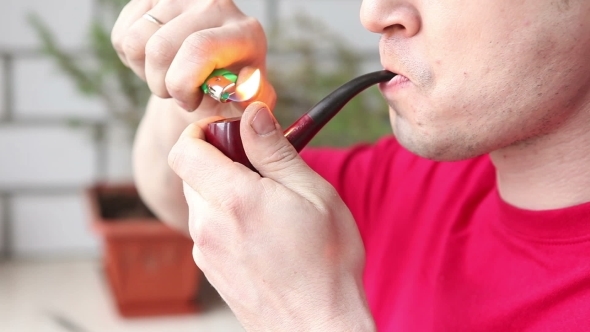 Man Lighting His Pipe