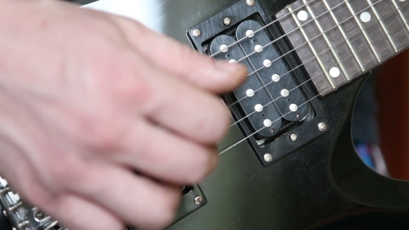 Man Playing The Electric Guitar Brute Force