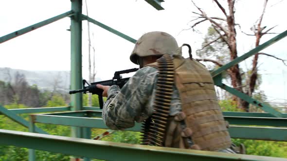 Military soldier guarding with a rifle