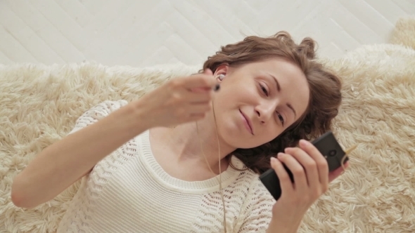 Woman Listening Music In Headphones