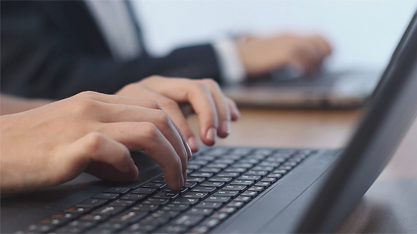 Business People Typing on a Laptops alt