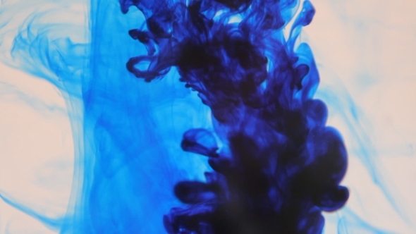 Blue Ink Poured Into Clear Water