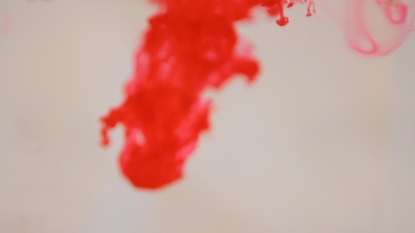 Red Ink Dissolve Slowly In Clear Water