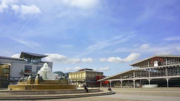 Fast Timelapse of La Grande Halle and a fountain on Parc de la Villette in Paris