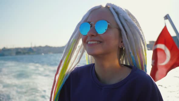 Attractive Young Girl Enjoys Boat Trip Sailing on a Ship in Turkey