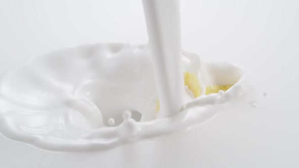 Cornflakes Falling Into the Flowing Milk