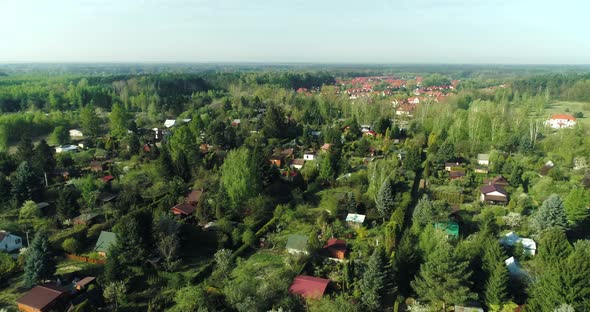 Aerial view on allotment gardens adjacent to a housing estate.