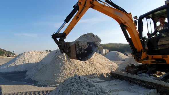 Excavators Level the Site with Sand, Moving Sand From the Mounds