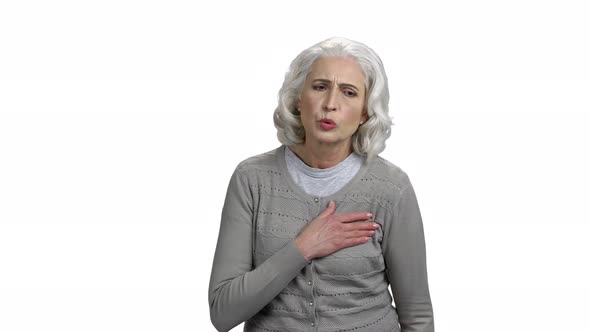 Mature Woman with Chest Pain on White Background