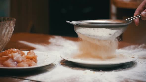 Sifting the Flour Through a Sieve in Slow Motion