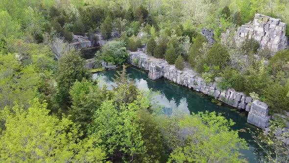 Aerial Over Abandoned Quarry Filled with Water