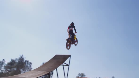 Motocross rider going off big jump, slow motion, 4K shot on RED Epic