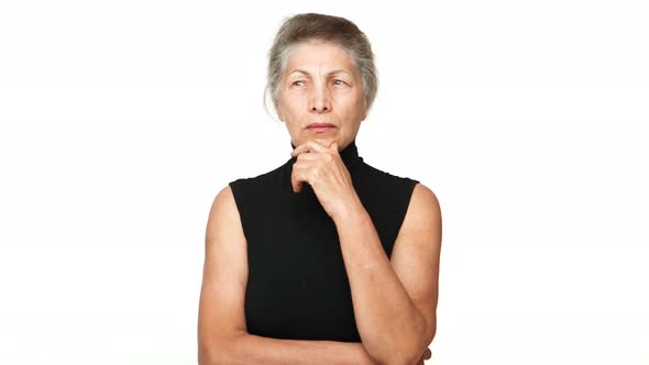 Senior Serious Woman Touching Her Chin Thinking Hard Finally Figure Out Recall Something Gesturing