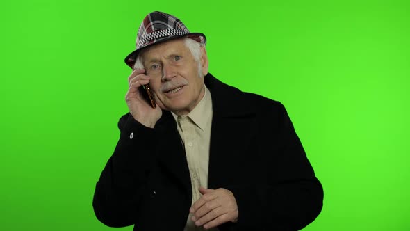 Elderly Stylish Caucasian Grandfather Man Using Smartphone for Online Shopping