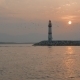 Boats Passing Lighthouse With Rising Sun At Background. . - VideoHive Item for Sale