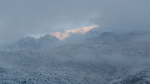 Clouds Over The Mountain Slope