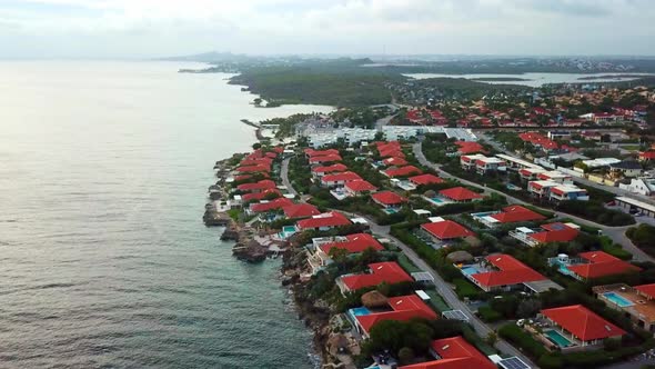 Panoramic aerial view of mansions on the shore of Jan Thiel Beach, Curacao, Dutch Caribbean island