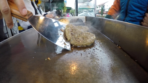 Street Vendor Frying Meat Or Cutlet