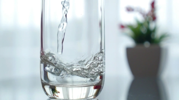 Pouring Water In a Glass. . 