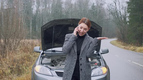 Sad Woman with Phone To Her Ear Start To Crying Near Car