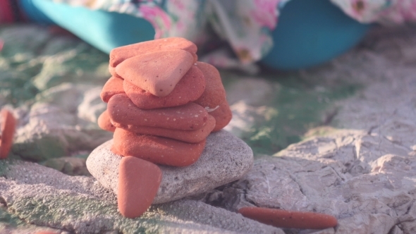 Building a Pyramid From Pebble Stones