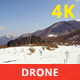 Aerial View of Snowy Mountains in a Sunny Day - VideoHive Item for Sale