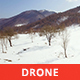 Aerial View of a Snowy Valley in a Sunny Day - VideoHive Item for Sale