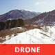 Flying over Snowy Mountains in a Sunny Day - VideoHive Item for Sale